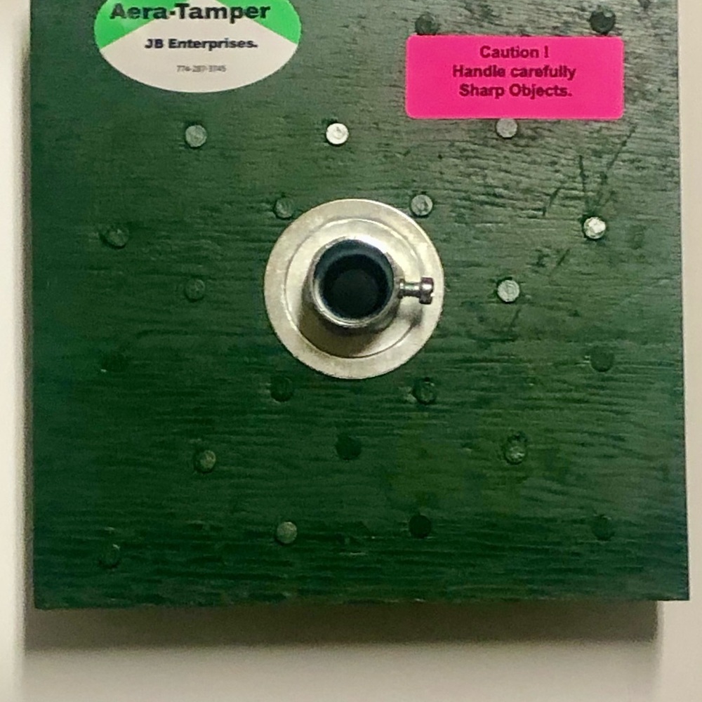 Aera-Tamper - Loosens soil and tamps grass seed.